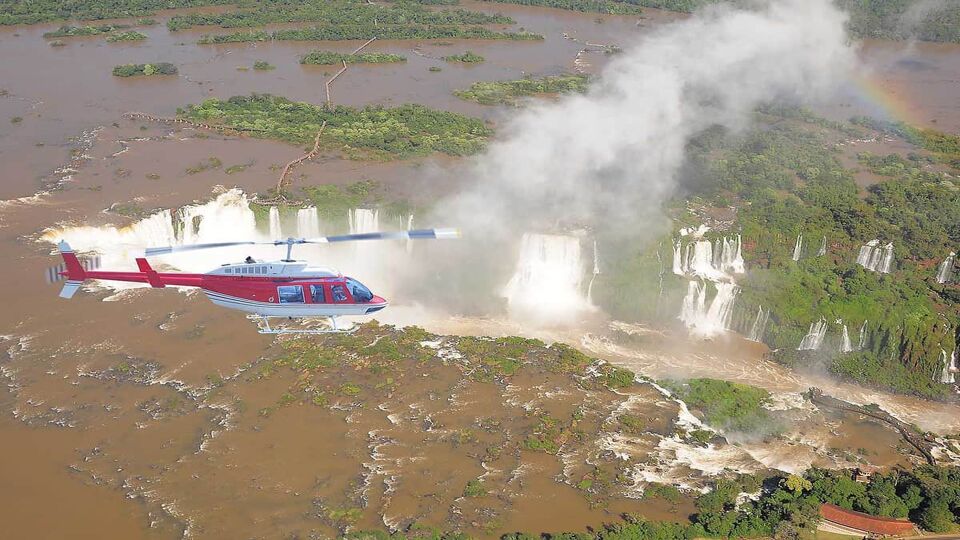 Helicopter flight above Iguazu falls. Argentina-Brazil.