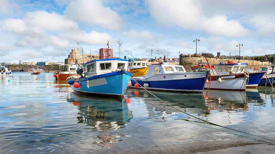 Fishing boats in a harbour in the isles of scilly