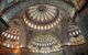 Domed and tiled ceiling of a large mosque