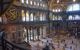 Interior of large mosque with light streaming in from the windows