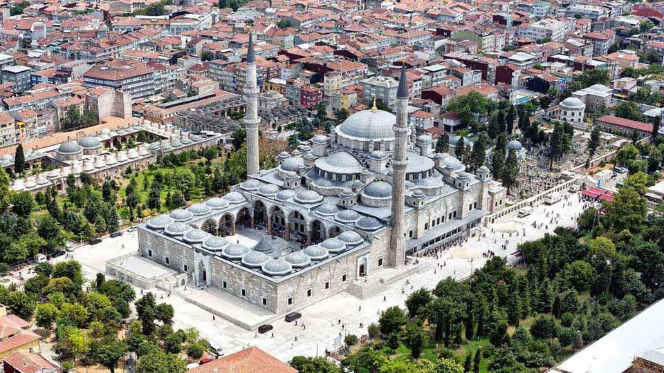 Aerial view of large mosque surrounded by a park