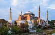 Grand mosque with four minarets at golden hour