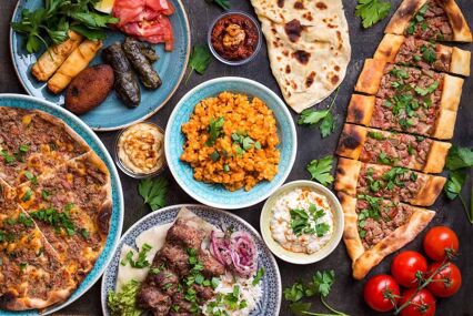 Aerial view down onto a table full of Turkish meze plates
