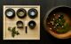 Bowels of gourmet food served on wooden tray