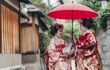 Geisha woman share umbrella