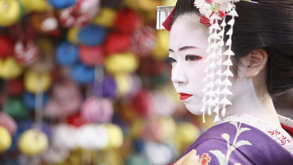 Geisha woman with white face paint