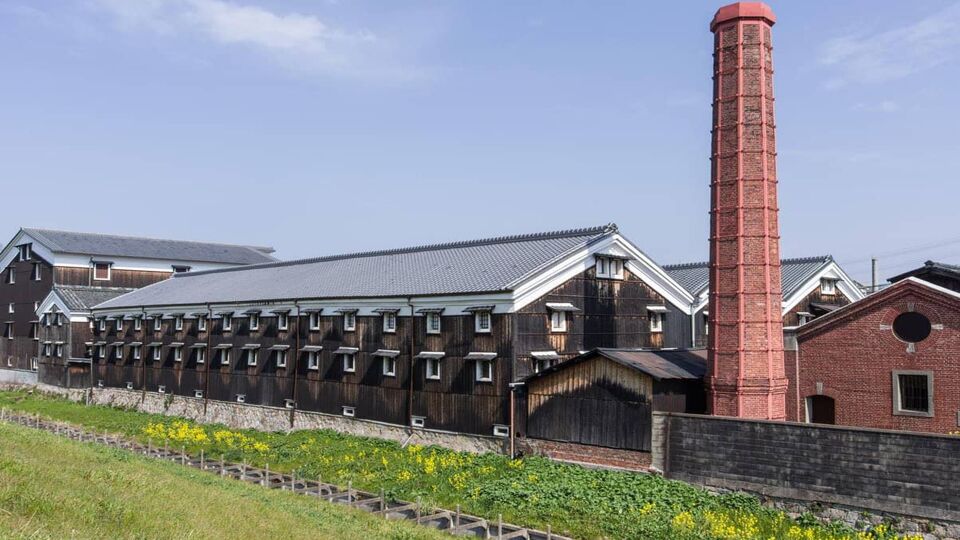 Brewery with chimney and warehouse in day