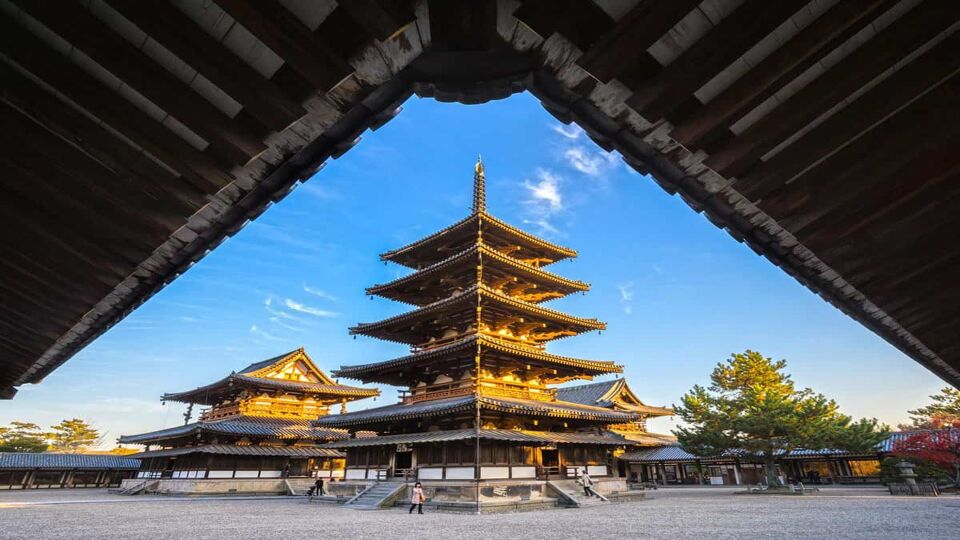Four story pagoda under blue sky