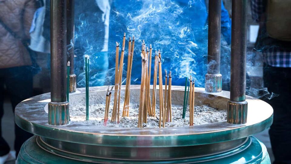 Incense burns in large earn