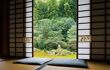 Shoji doors open onto green garden