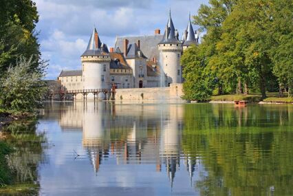 Beautiful castle with turrets next to the river