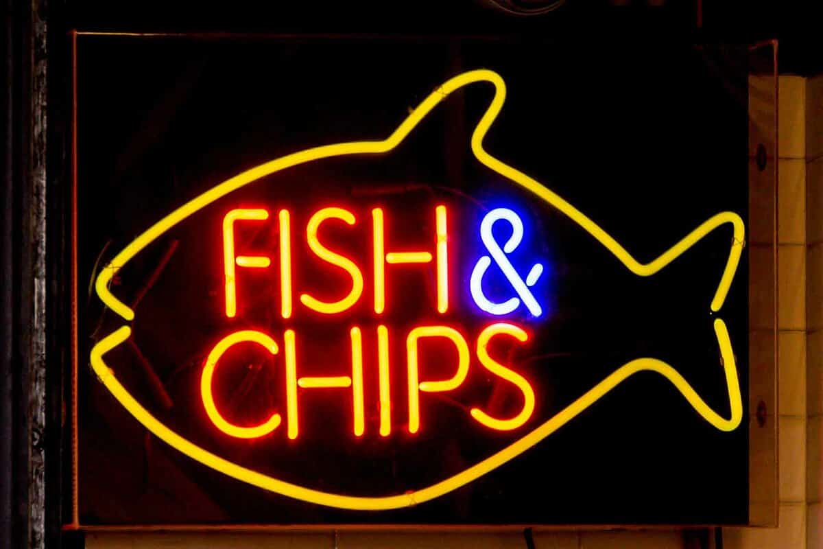 Close up of an electronic fish and chip sign