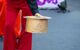 Close up of a street performer offering his hat for collecting money