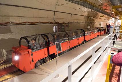 Royal Mails Museum, Subterranean railway under London streets, Small narrow passage train for tourists that have replaced the original post and parcel carriages