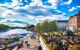 People enjoy the sunny weather by the River Thames