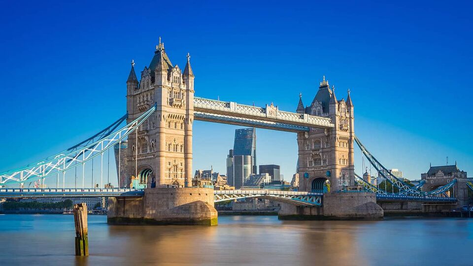 View of the tower on a sunny day, with City of London behind