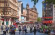 Street view of Leicester Square with tourists