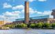 External view of the art gallery - a big oblong brick building with glass roof and a single large square chimney