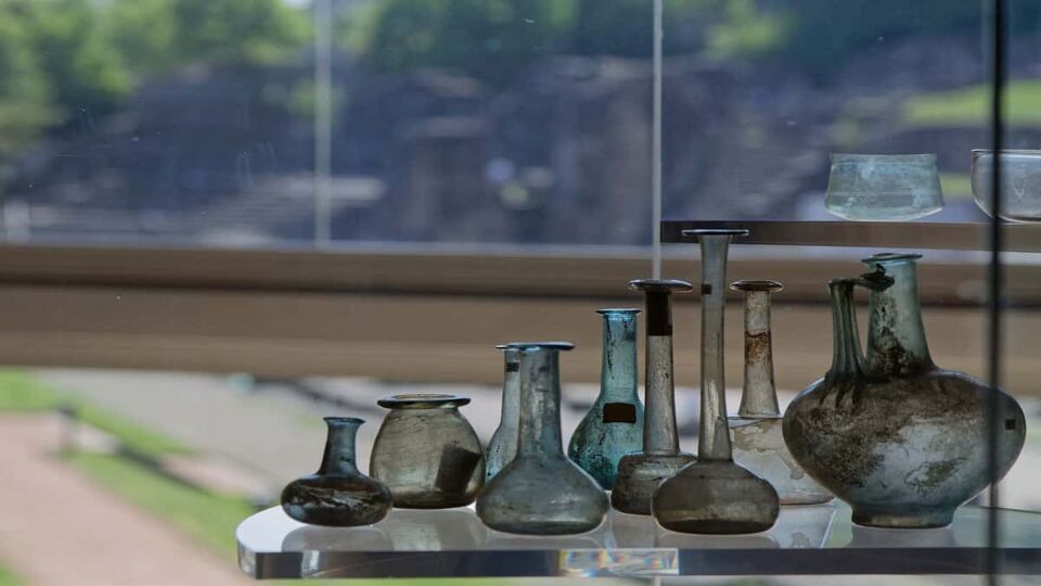 Glass bottles and jars artefacts on display
