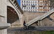 Cycling on Berges du Rhone. Quays, streets, cycling and walking paths along the Rhone river in Lyon