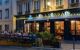 Photo of a bouchon cafe at night, with atmospheric lighting