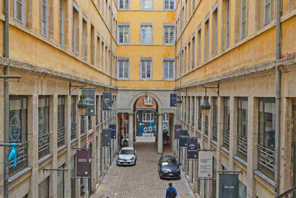 looking down a narrow street called the Village des Createurs in Lyon, home to design shops