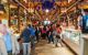 People shopping at a covered market.