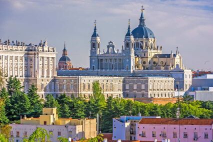 Exterior of La Almudena Cathedral in the late afternoon.