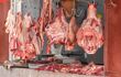 Cuts of meat hanging in a traditional, Moroccan butcher's shop