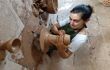 Woman making a vase on a pottery wheel