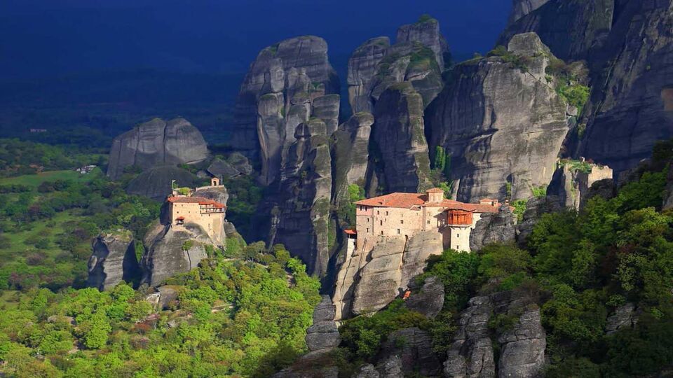 Monastery of Roussanou and dark clouds in the background, Meteora, Greece