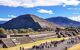 Teotihuacan pyramid with tourists walking in the Avenue of the Dead