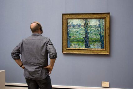 Man admiring a picture by Vincent van Gogh at the Neue Pinakothek, museum of European Art of the 18th and 19th centuries.