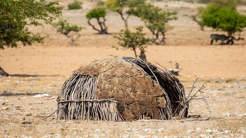 a traditional home of the himba tribe made out of mud, clay and straw