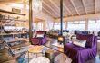 Living space in a lodge with purple sofas