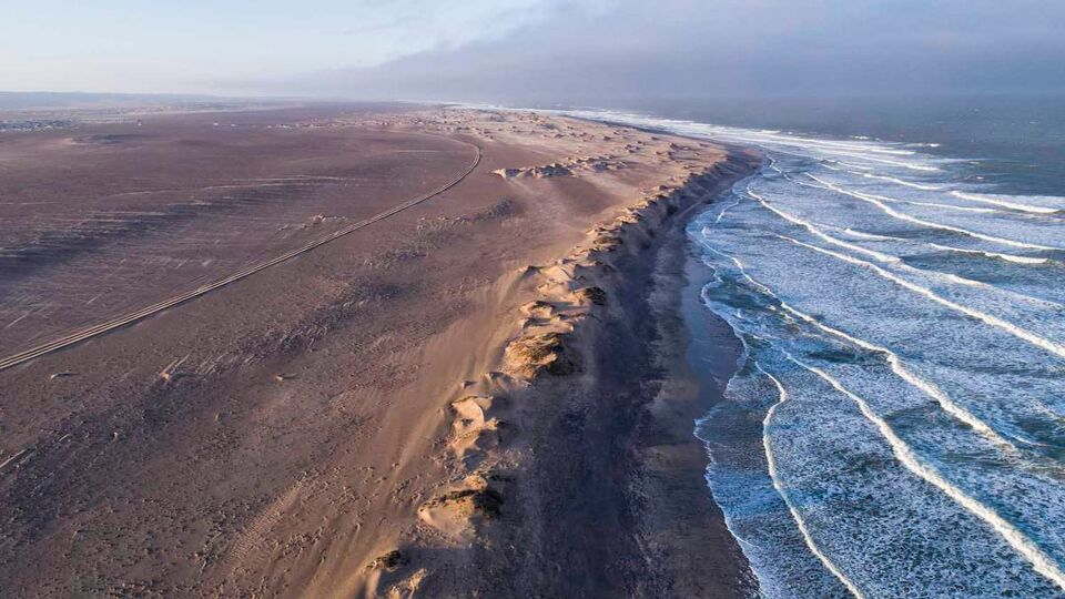 an arial shot of the skeleton coast meeting the sea