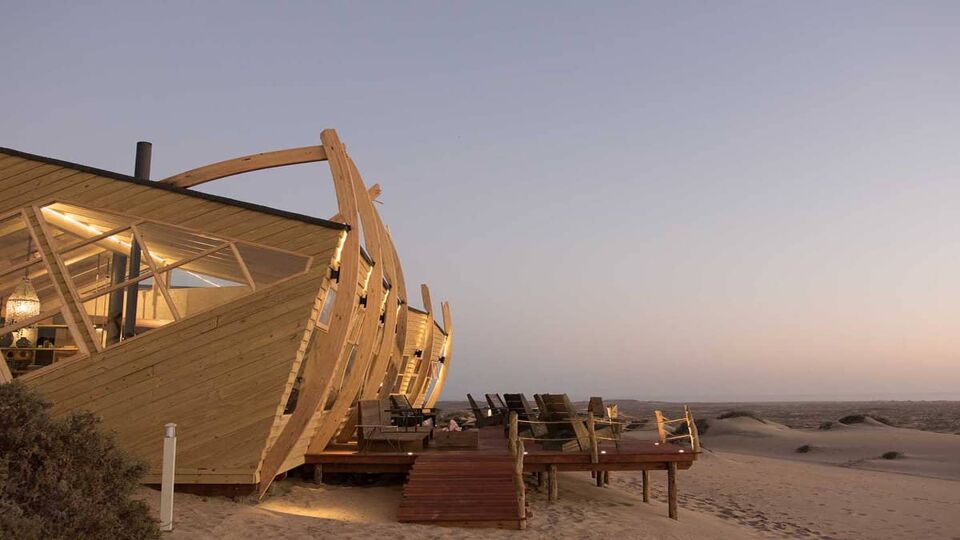 The exterior of a boated shipwreck accommodation at sunset