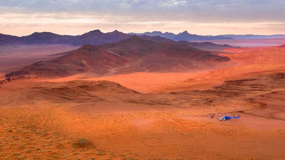 an arial shot of the orange Sossusvlei Desert