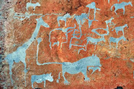 Bushman prehistoric rock engravings in orange and blue