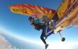 Woman in tandem screaming as they jump