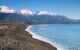 Kaikoura coast with snow capped mountain range of southern alps and blue sea in Kaikoura, New Zealand