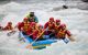 Close up of inflatable raft with 6 passengers on white water