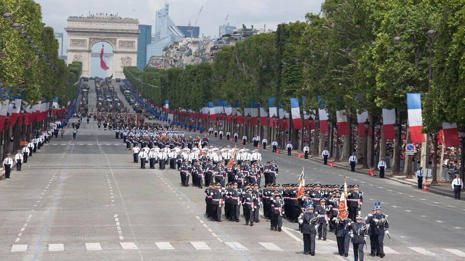 Military band performing down the street from Arc de Triumphe