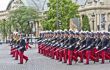 View of the military band marching down the street with their respective uniform