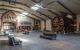 A view of the hall at Pommery champagne house in Reims with a single opening of natural sunlight from the ceiling