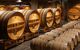 Oak barrels in the cellar containing champagne in Reims