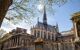 A low angle view of the cathedral building on a sunny blue day