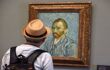 Man looking at a self portrait of Van Gogh