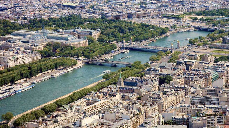 Aerial view of the blue waters at River Seine running through the city of Paris