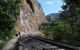 Hikers walk alongside the railroad tracks